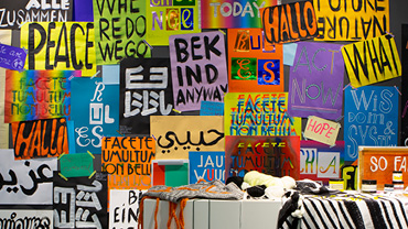Wall with colorful lettered posters