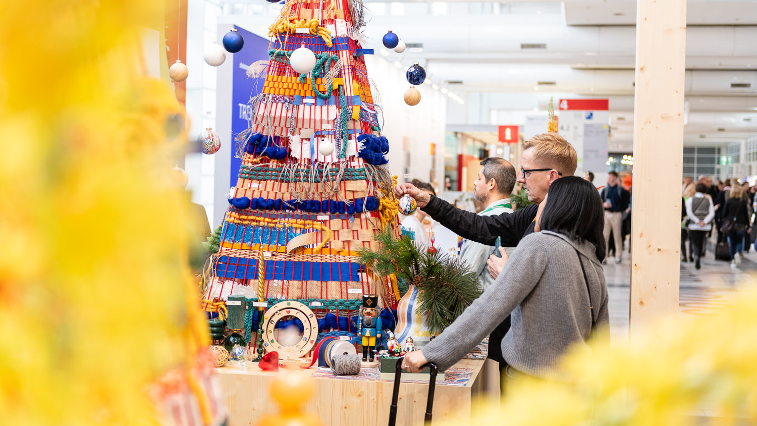 a man and a woman at the trend area of Christmasworld 2024