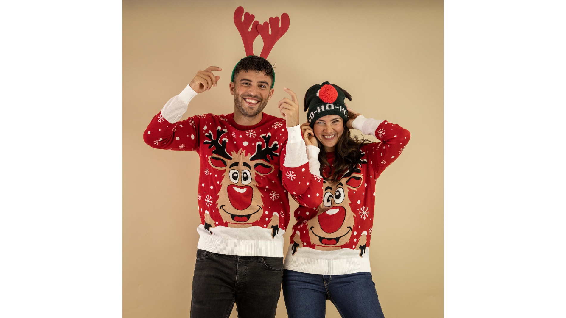 Two people in Christmas jumpers