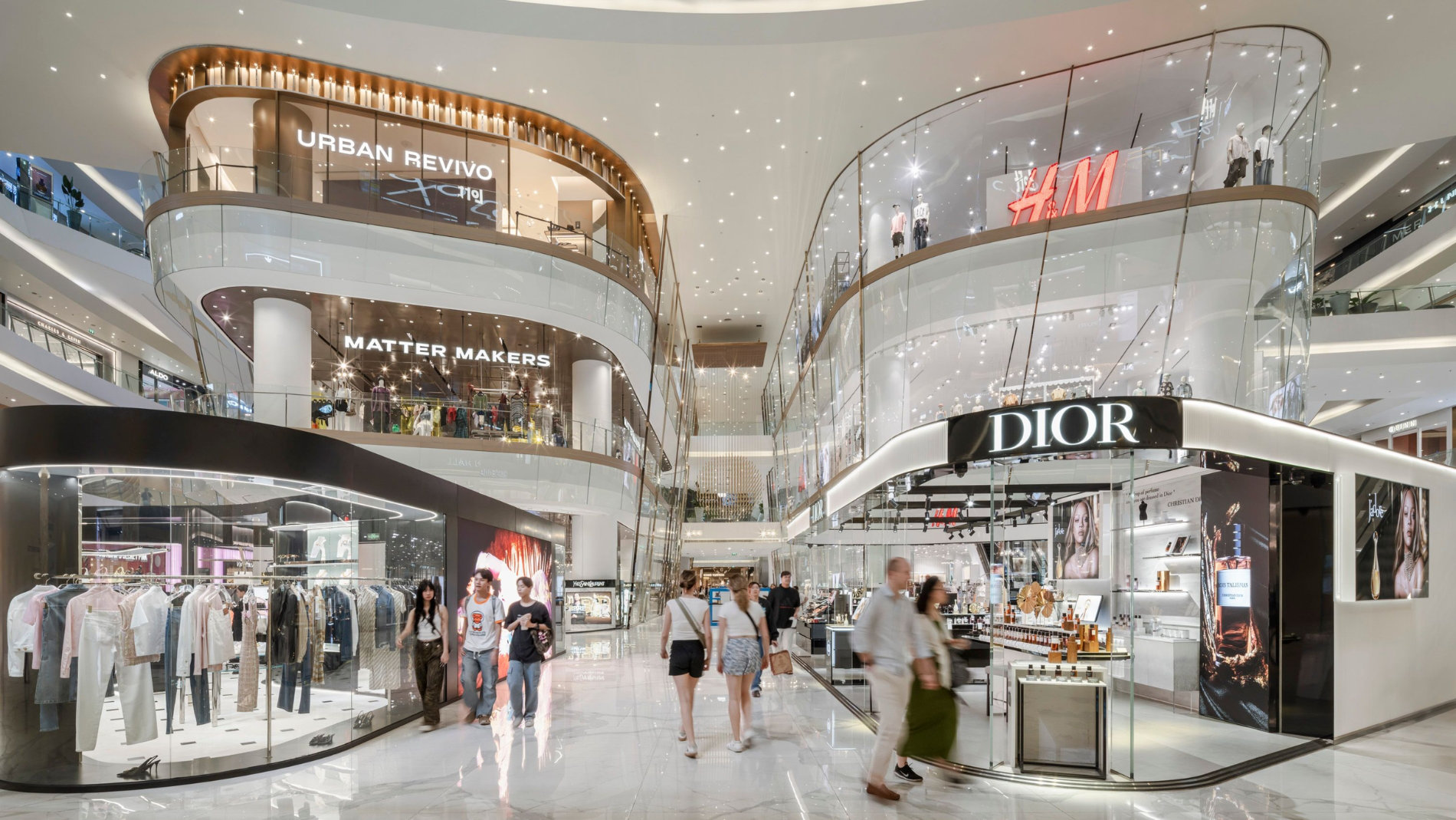 Interior view of a modern shopping mall with stores