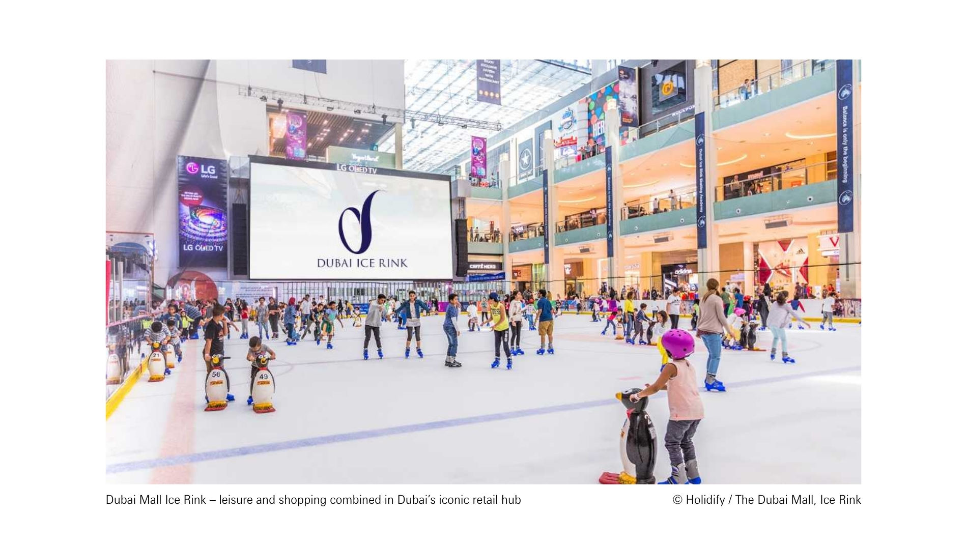 Ice rink in The Dubai Mall with visitors combining leisure and shopping in Dubai’s iconic retail hub.