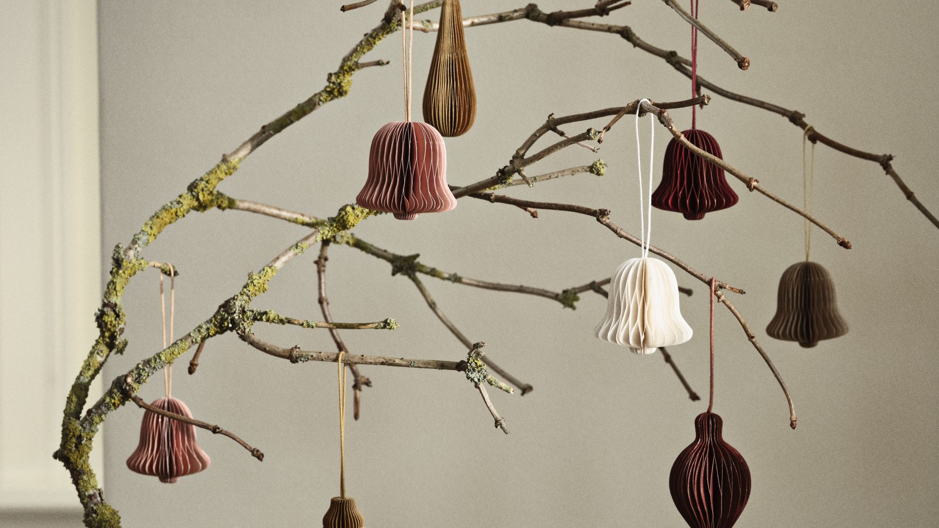 Honeycomb ornaments hanging from a branch