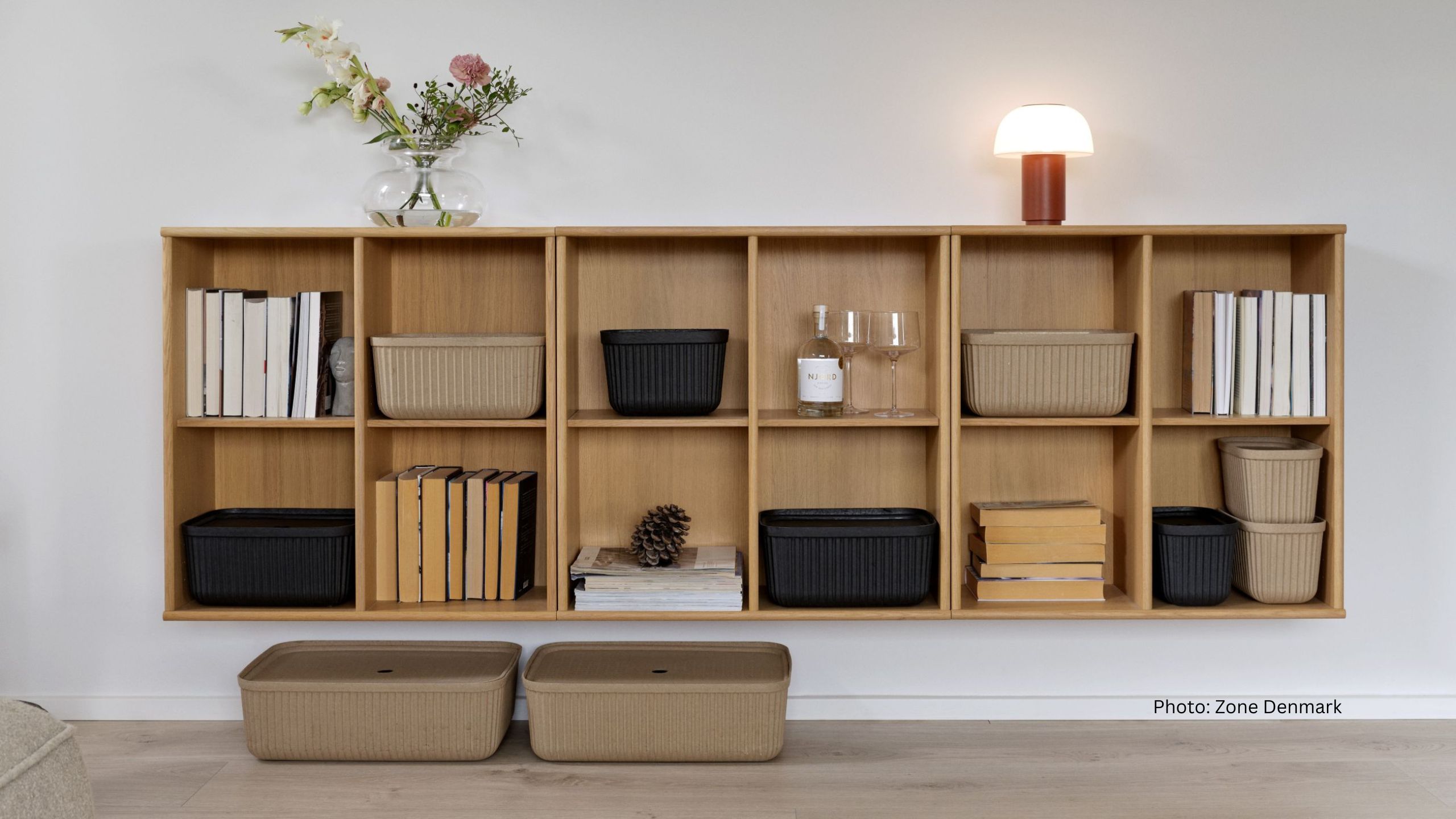 Living room shelf with stylish storage baskets and books