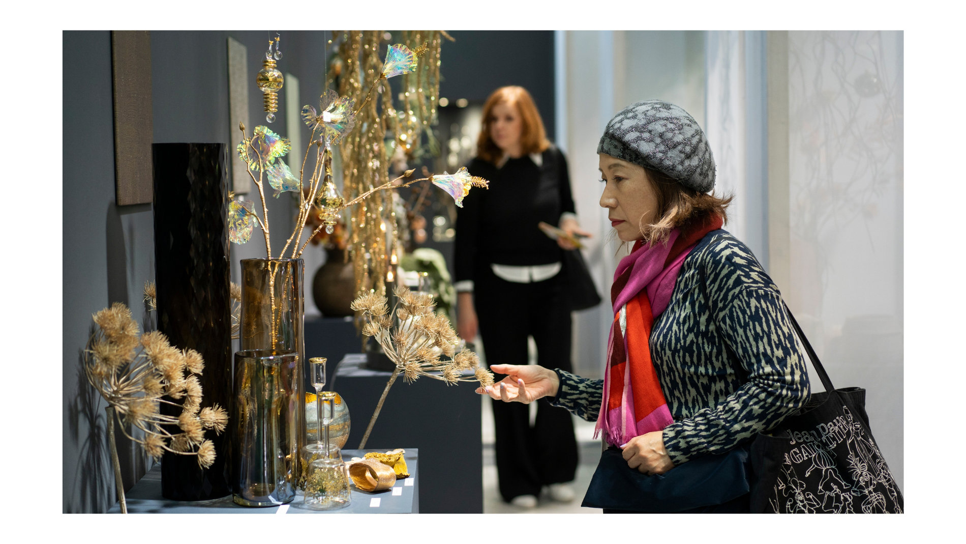 Woman looking at Christmas decorations at a trade fair stand